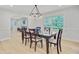 Dining room with table and chairs, modern lighting, and a view into the living area at 108 E Walker Dr, Summerville, SC 29483