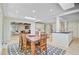Dining room with wooden furniture, patterned rug, and an open-concept kitchen at 108 E Walker Dr, Summerville, SC 29483
