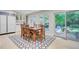 Dining room with a wood table, many windows, and access to the backyard at 108 E Walker Dr, Summerville, SC 29483