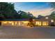 Charming home with a brick facade and bright windows, nestled on a wooded lot with a gravel driveway at 108 E Walker Dr, Summerville, SC 29483