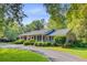 Beautiful brick home with manicured landscaping and a welcoming driveway on a sunny day at 108 E Walker Dr, Summerville, SC 29483