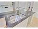 Granite counters and stainless sink in this gourmet kitchen with modern appliances and custom cabinets at 108 E Walker Dr, Summerville, SC 29483