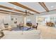 Spacious living room with wood beams, access to kitchen, and comfortable seating at 108 E Walker Dr, Summerville, SC 29483