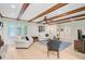 Bright living room with wood beams, brick fireplace, and access to other rooms at 108 E Walker Dr, Summerville, SC 29483