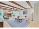 Comfortable living area with brick fireplace, wood beams, and natural light at 108 E Walker Dr, Summerville, SC 29483
