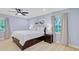 This main bedroom features hardwood floors, a ceiling fan, and two windows at 108 E Walker Dr, Summerville, SC 29483