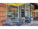 Inviting restaurant patio with tables, umbrellas, and views of the street at 108 E Walker Dr, Summerville, SC 29483