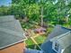 A rooftop view showcasing the deck, backyard garden, patio, and mature trees in a peaceful setting at 1111 Ole South Ct, Moncks Corner, SC 29461