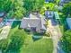Expansive property with a brick home, detached garage, and lush greenery in a tranquil neighborhood at 1111 Ole South Ct, Moncks Corner, SC 29461