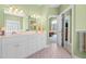 Main bathroom featuring a double sink vanity and access to the main bedroom at 1111 Ole South Ct, Moncks Corner, SC 29461