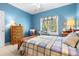 Bedroom with a blue and white plaid bedspread, wooden chest and nautical decor at 1111 Ole South Ct, Moncks Corner, SC 29461