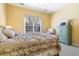 Serene bedroom with light yellow walls, offering a peaceful retreat with a comfy bed and soothing decor at 1111 Ole South Ct, Moncks Corner, SC 29461