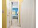 Open doorway from bathroom to bedroom shows tiled floors and white shower curtain at 1111 Ole South Ct, Moncks Corner, SC 29461
