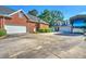 Large driveway leading to a home, detached garage and RV garage at 1111 Ole South Ct, Moncks Corner, SC 29461
