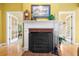 Traditional fireplace featuring white mantel, brick hearth, and wrought iron fire screen at 1111 Ole South Ct, Moncks Corner, SC 29461