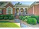A quaint brick path leads to the front door of this home at 1111 Ole South Ct, Moncks Corner, SC 29461
