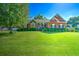 Beautiful single-story brick home features a lush green lawn and lovely mature shade trees at 1111 Ole South Ct, Moncks Corner, SC 29461