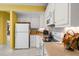 Functional kitchen with white appliances, plenty of cabinet space, and a clean, timeless design at 1111 Ole South Ct, Moncks Corner, SC 29461