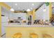 Bright kitchen with a breakfast bar and white cabinets and appliances at 1111 Ole South Ct, Moncks Corner, SC 29461