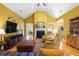 Spacious living area showcasing hardwood floors, a cozy fireplace, and natural light at 1111 Ole South Ct, Moncks Corner, SC 29461