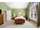 Airy main bedroom featuring a comfortable bed and two bedside tables at 1111 Ole South Ct, Moncks Corner, SC 29461