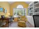Inviting home office featuring a large window, plush armchair, built in storage, and warm yellow walls at 1111 Ole South Ct, Moncks Corner, SC 29461