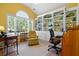 Bright office with vaulted ceiling, large window, built-in bookshelves, and comfortable chair, perfect for working from home at 1111 Ole South Ct, Moncks Corner, SC 29461