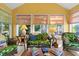 Comfortable sunroom with wicker furniture, bright natural light, and neutral tones that create an inviting space at 1111 Ole South Ct, Moncks Corner, SC 29461