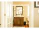 Bathroom with a vessel sink, granite countertop, and modern lighting at 12 Bee St # C, Charleston, SC 29403