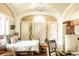 Well-lit bedroom with archways, kitchenette, and multiple closets at 12 Bee St # C, Charleston, SC 29403