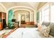 Sunlit bedroom features a cozy sitting area, modern decor, and ample natural light at 12 Bee St # C, Charleston, SC 29403