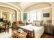 Bright bedroom with a comfortable bed, sitting area, and modern furnishings at 12 Bee St # C, Charleston, SC 29403