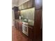 Gourmet kitchen featuring stainless steel appliances, dark cabinetry, and mosaic backsplash at 12 Bee St # C, Charleston, SC 29403