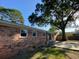 Brick exterior with a spacious backyard featuring new fencing and plenty of shade at 121 Camelot Dr, Goose Creek, SC 29445