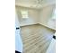 Comfortable bedroom with neutral walls, laminate flooring, and natural light from windows at 121 Camelot Dr, Goose Creek, SC 29445