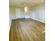 Bright bonus room with door, ceiling fan and stairs to the lower level at 121 Camelot Dr, Goose Creek, SC 29445