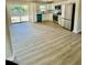 Bright, open kitchen with stainless steel appliances and sliding door to the backyard at 121 Camelot Dr, Goose Creek, SC 29445