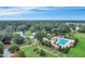 A scenic aerial view showcases a community with a pool, clubhouse, and sprawling green spaces, perfect for outdoor living at 121 Cherry Grove, Summerville, SC 29483