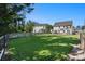 Large backyard with well-maintained lawn, featuring a hammock, fence and a beautiful patio at 121 Cherry Grove, Summerville, SC 29483