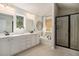 Bright bathroom featuring double vanity, soaking tub, and glass-enclosed shower at 121 Cherry Grove, Summerville, SC 29483