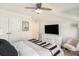 Serene bedroom with white furniture, complemented by a ceiling fan, and plush bedding at 121 Cherry Grove, Summerville, SC 29483