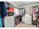 Walk-in closet with custom built-in shelving and ample storage for clothes and accessories at 121 Cherry Grove, Summerville, SC 29483