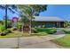 The YMCA, a community center with a metal roof and colorful accents, is surrounded by lush greenery and a sidewalk at 121 Cherry Grove, Summerville, SC 29483