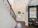 Elegant foyer features hardwood floors, high ceilings, and a staircase with decorative iron railings at 121 Cherry Grove, Summerville, SC 29483
