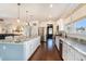 Spacious kitchen with a large island, stainless steel appliances, granite countertops, and hardwood floors at 121 Cherry Grove, Summerville, SC 29483