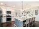 Bright eat-in kitchen features a large island with seating, stainless steel appliances, and stylish pendant lighting at 121 Cherry Grove, Summerville, SC 29483