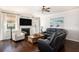 Cozy living room with a fireplace, plush seating, and a 'Beach House' sign for a relaxed atmosphere at 121 Cherry Grove, Summerville, SC 29483