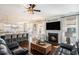Open-concept living room with fireplace and view into the kitchen, blending comfort with modern living at 121 Cherry Grove, Summerville, SC 29483