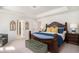Luxurious main bedroom with an elegant bed, tray ceiling, and stylish decor; adjacent to arched doorway at 121 Cherry Grove, Summerville, SC 29483