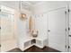 Well-organized mudroom with bench seating, storage, and coat hooks, connecting to a bright, clean bathroom at 121 Cherry Grove, Summerville, SC 29483